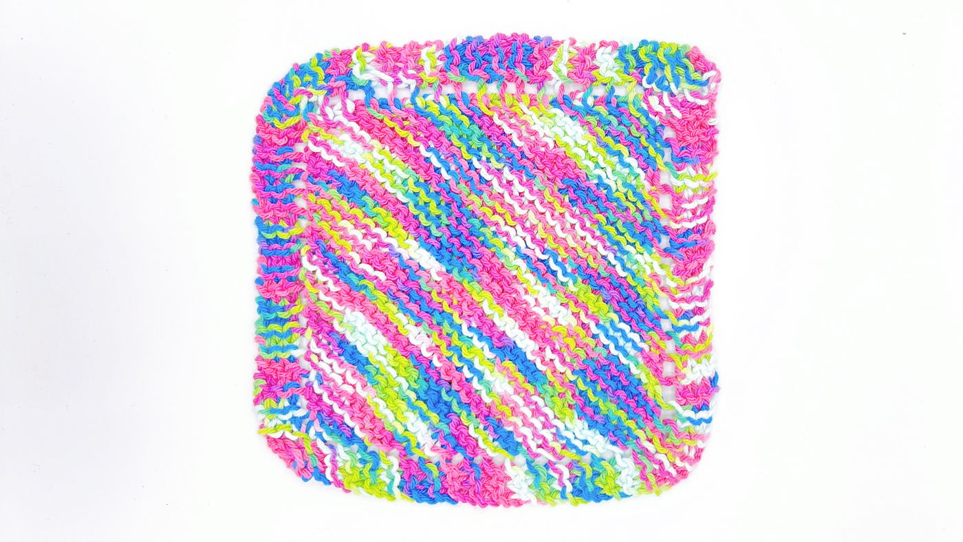 A handmade Granny Dishcloth with a classic knitted design, crafted from 100% cotton. Soft, absorbent, and reusable, perfect for washing dishes or wiping surfaces in an eco-friendly kitchen.