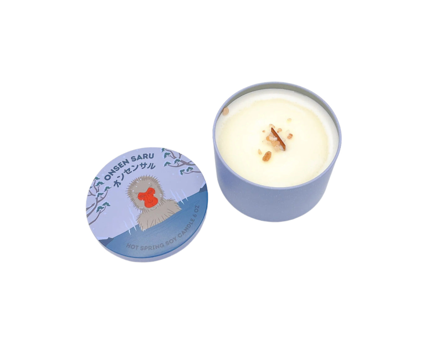 Onsen Saru Candle in a tin, hand-poured soy candle scented with Japanese matsu pine, cedarwood, snow, and Himalayan pink salt.