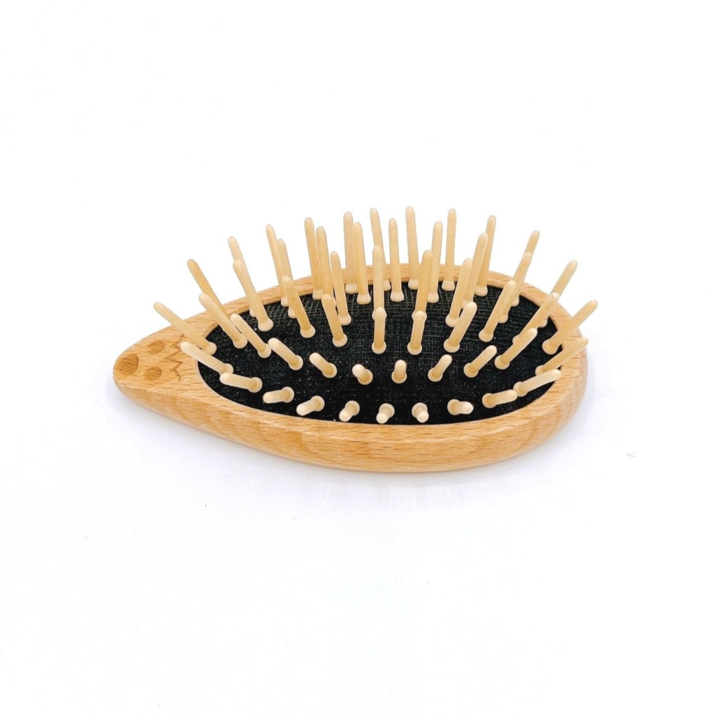 Redecker Hedgehog Travel Brush with wood bristles and a cute hedgehog design for compact and gentle hair care on the go.