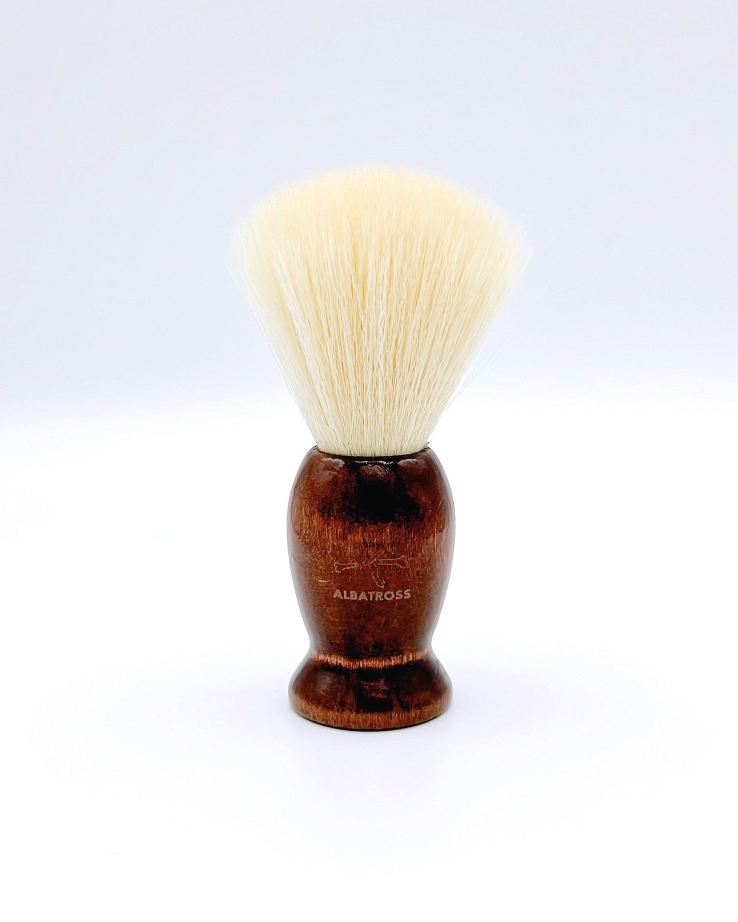 Albatross shaving brush with a wooden handle and soft vegan bristles, perfect for a smooth and eco-friendly shave.