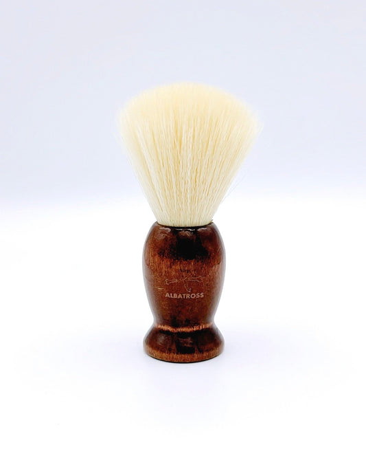 Albatross shaving brush with a wooden handle and soft vegan bristles, perfect for a smooth and eco-friendly shave.