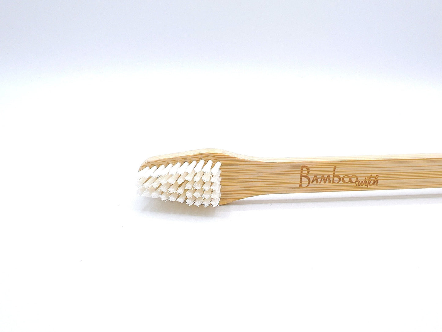 Eco-friendly Bamboo Dog Toothbrush with soft bristles, designed for effective pet dental care, suitable for dogs of all sizes.