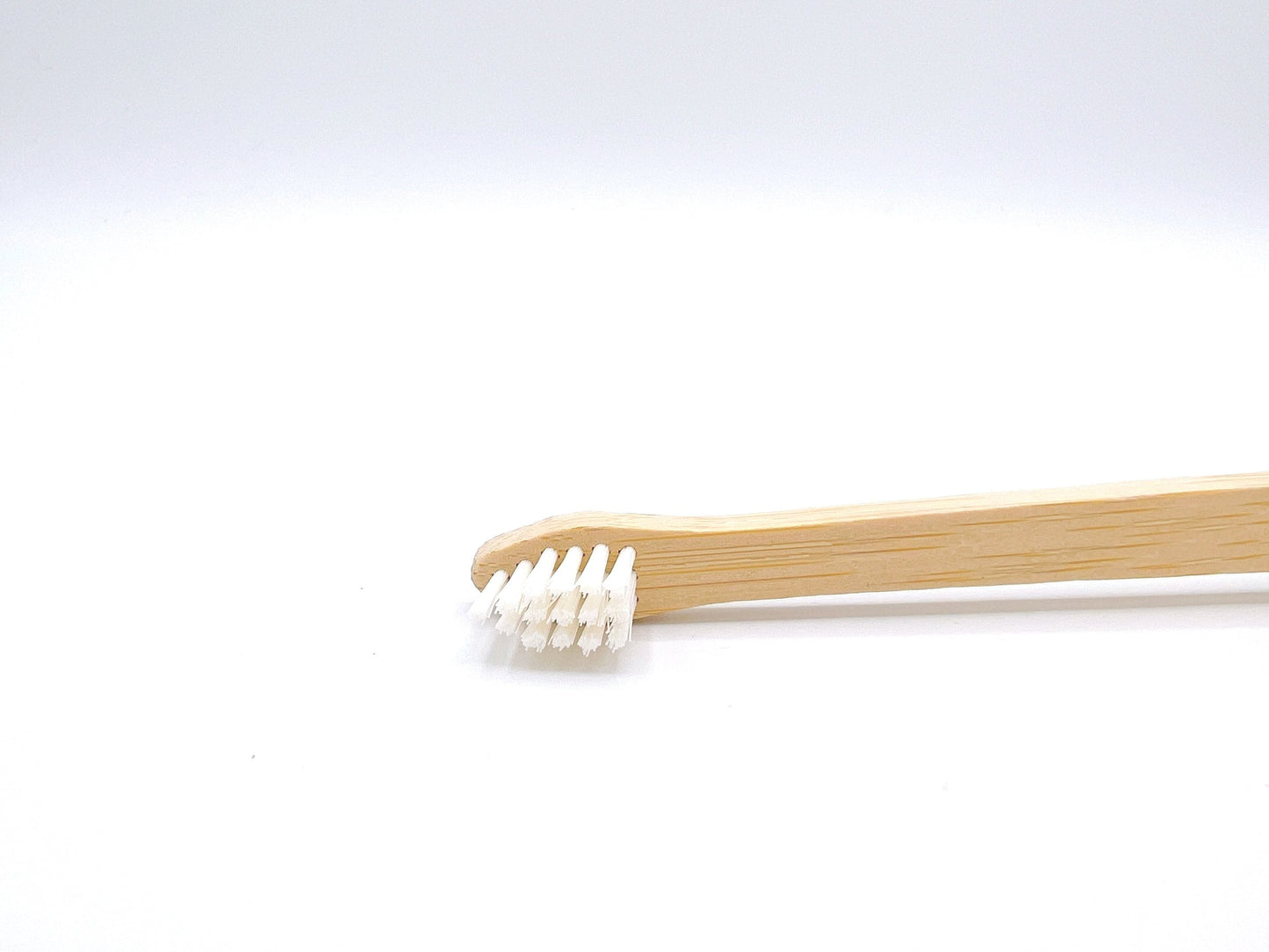 Eco-friendly Bamboo Dog Toothbrush with soft bristles, designed for effective pet dental care, suitable for dogs of all sizes.