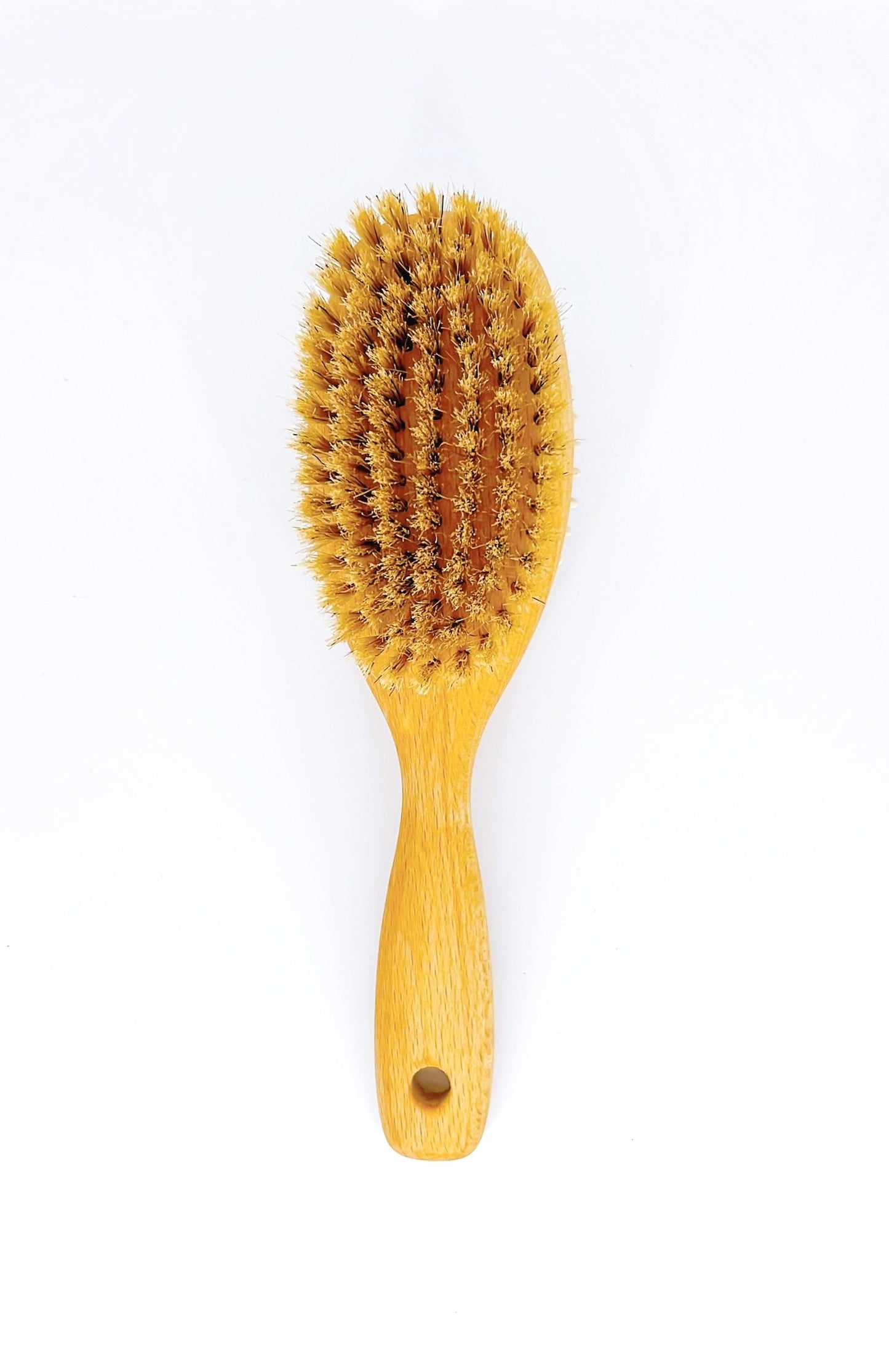 Redecker Dog Brush is a high-quality wooden brush with soft bristles, perfect for gentle grooming and detangling your pet's fur.