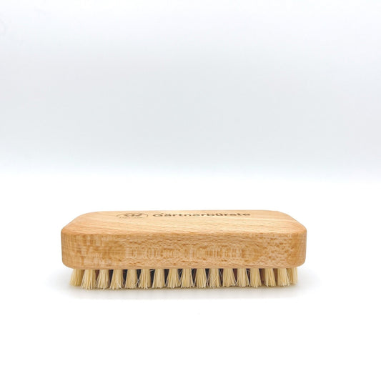 Redecker durable brush with stiff natural bristles, designed for cleaning dirt from nails. Eco-friendly and effective.