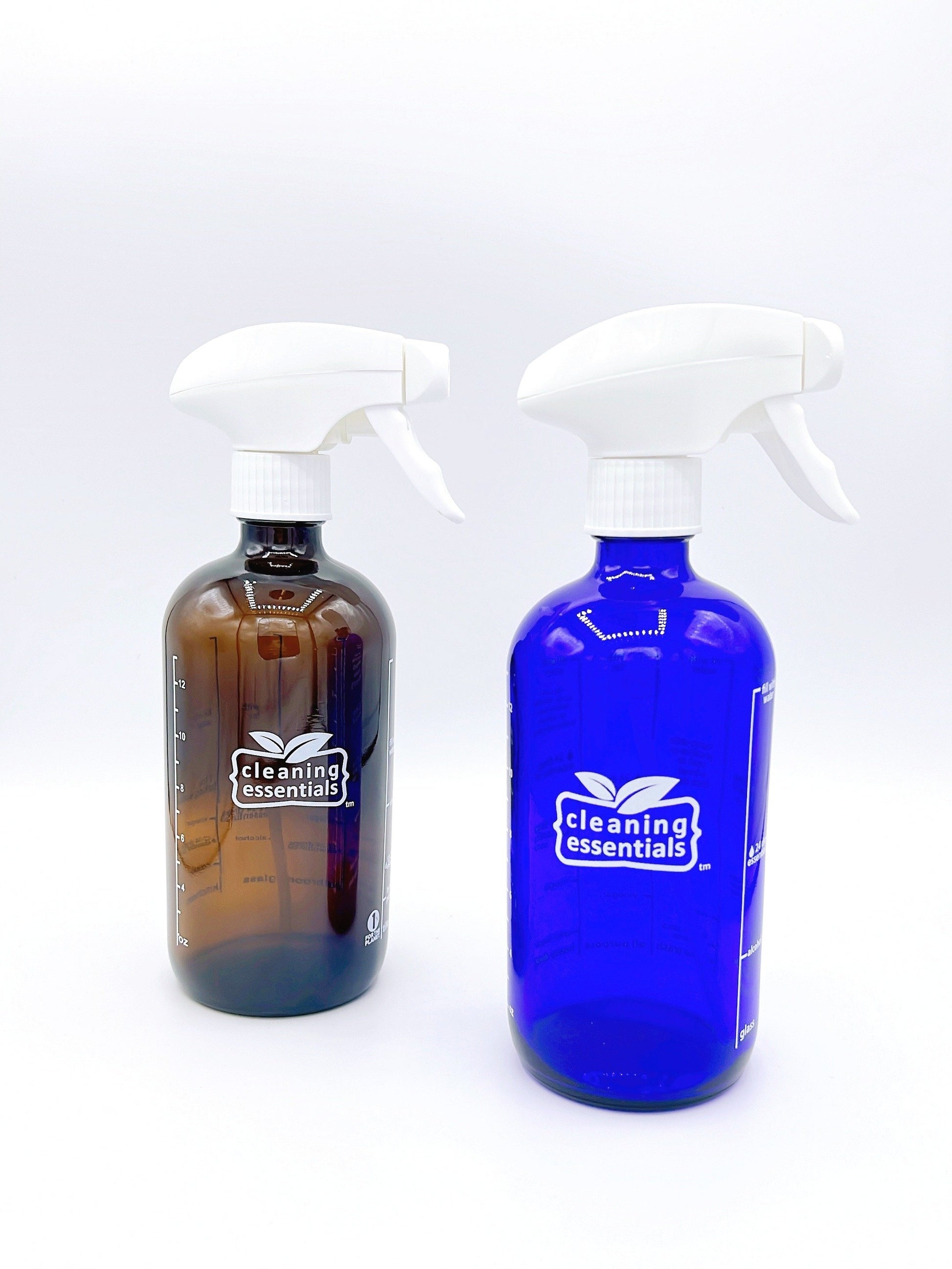 Cleaning Essentials Glass Spray Bottle in blue or amber, perfect for eco-friendly cleaning with a durable, reusable design.