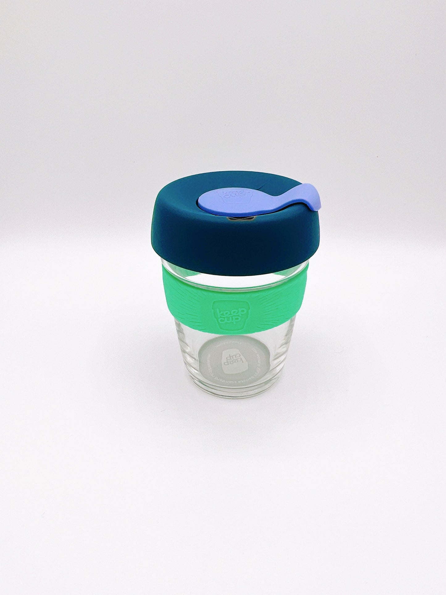 Reusable glass, eco-friendly coffee cup in a sleek design. Perfect for on-the-go drinks and reducing single-use waste.