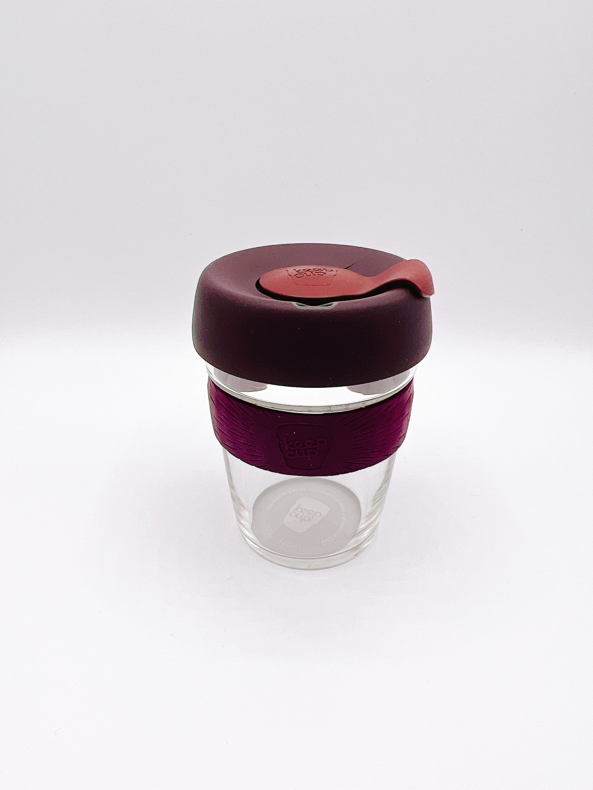 Reusable glass, eco-friendly coffee cup in a sleek design. Perfect for on-the-go drinks and reducing single-use waste.