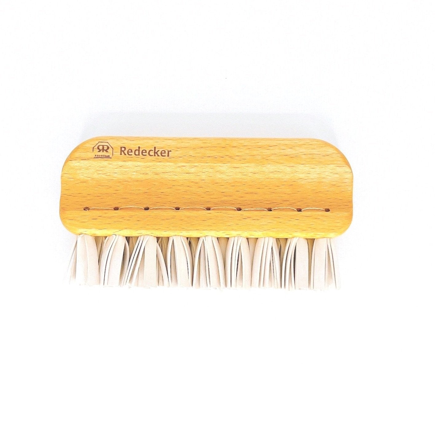 Redecker Lint Brush with wooden handle and rubber bristles, perfect for removing lint and pet hair from clothing and upholstery.