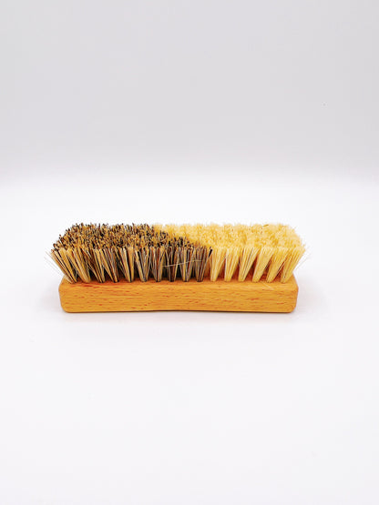 Eco-friendly Redecker veggie brush with natural bristles and a wooden handle. Ideal for cleaning fruits and vegetables.