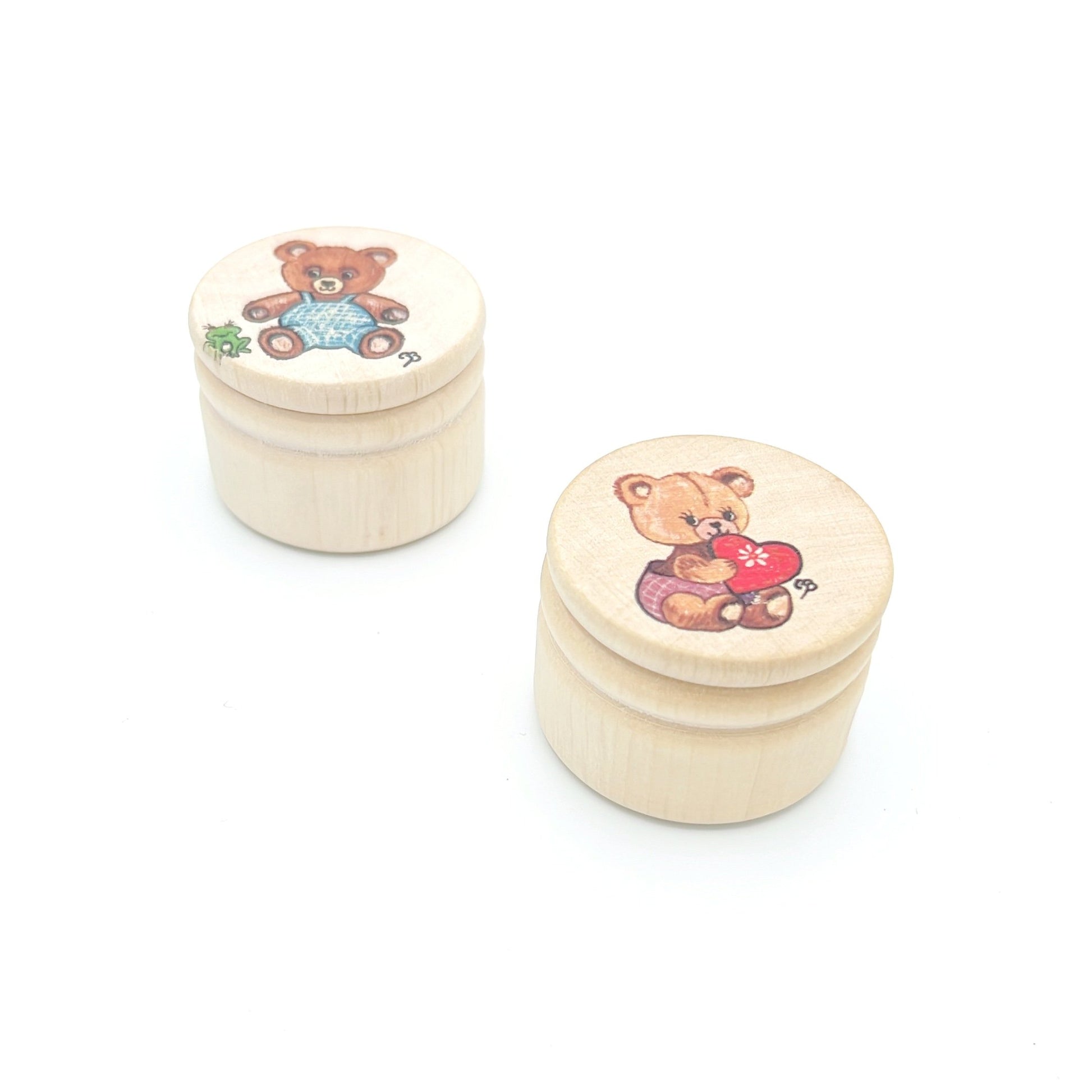 Wooden box for storing kids' teeth with a charming design.